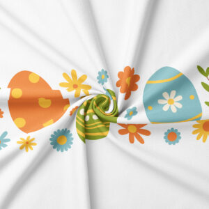 zbliżenie na wzór z dużymi pisankami w pomarańczowym, zielonym i niebieskim kolorze oraz drobnymi kwiatkami