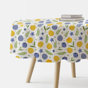 okrągły obrus na stole z wzorem pisanek i wiosennych kwiatów