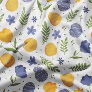 detal wzoru z żółtymi i niebieskimi pisankami oraz zielonymi listkami