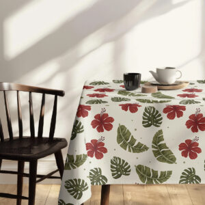 Detal narożnika obrusa ukazujący powtarzalny wzór liści i kwiatów