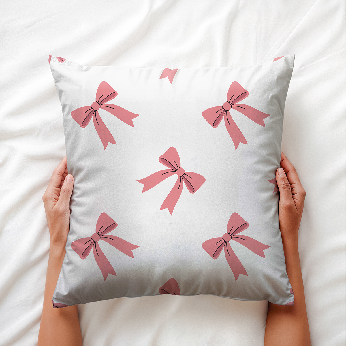 Zbliżenie na wzór różowych kokardek i miękką tkaninę poduszki