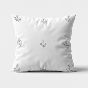 główne ujęcie poduszki dekoracyjnej z drobnym wzorem listków i kropek na jasnym tle