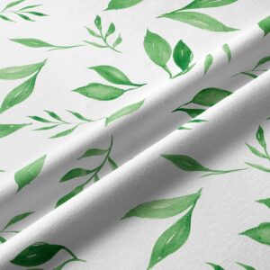 Zbliżenie na tkaninę i akwarelowe pociągnięcia pędzla w liściach