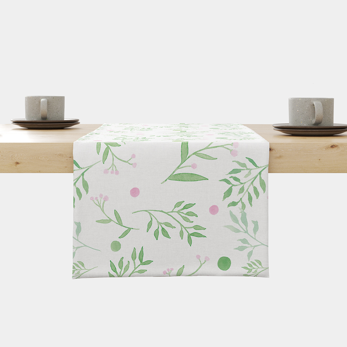 Bieżnik z akwarelowym wzorem gałązek i różowych kropek rozłożony na stole — główne ujęcie produktu
