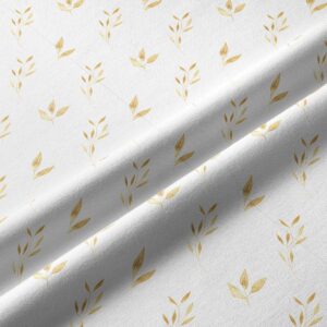 Zbliżenie na fakturę tkaniny i złoty motyw liści