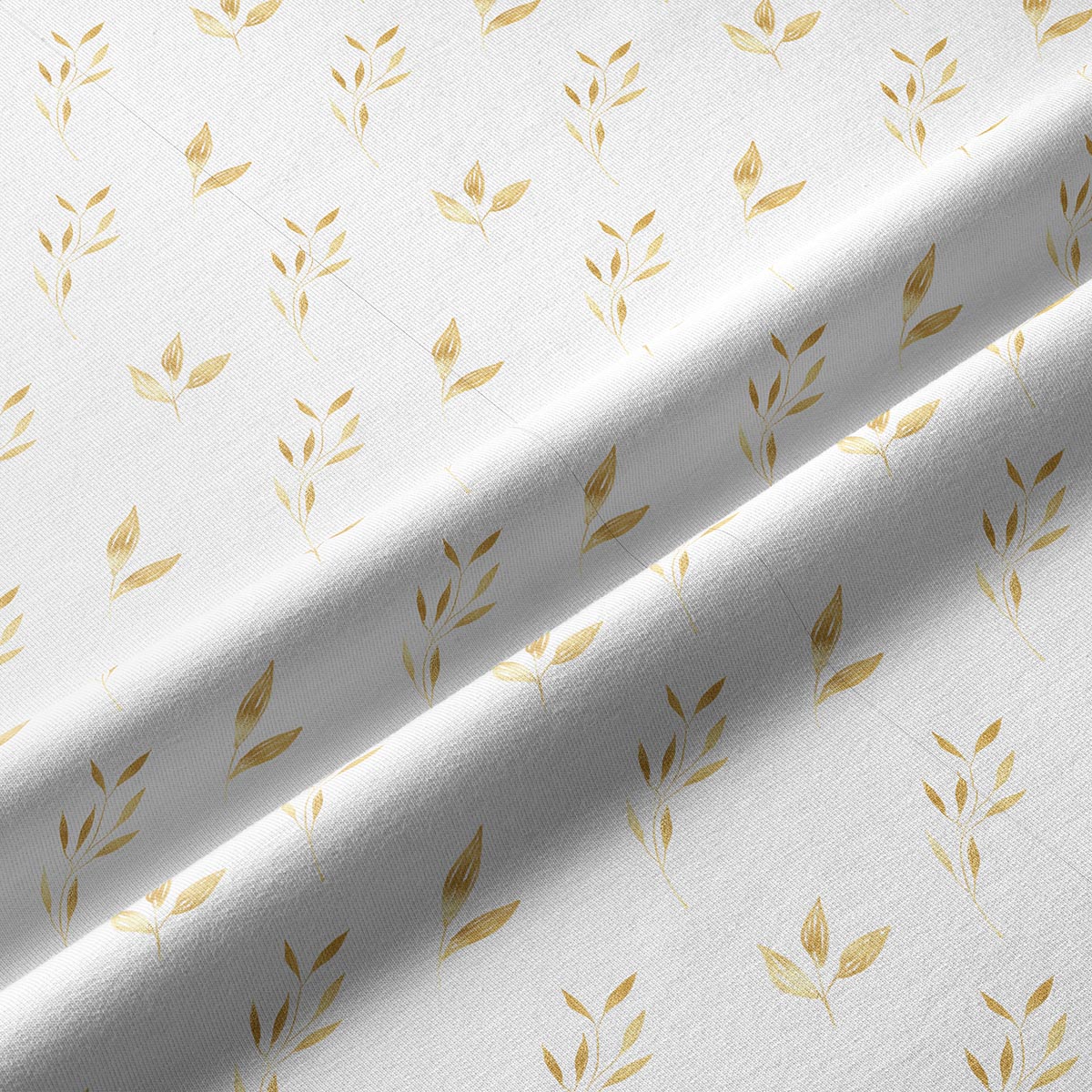 Zbliżenie na fakturę tkaniny i złoty motyw liści