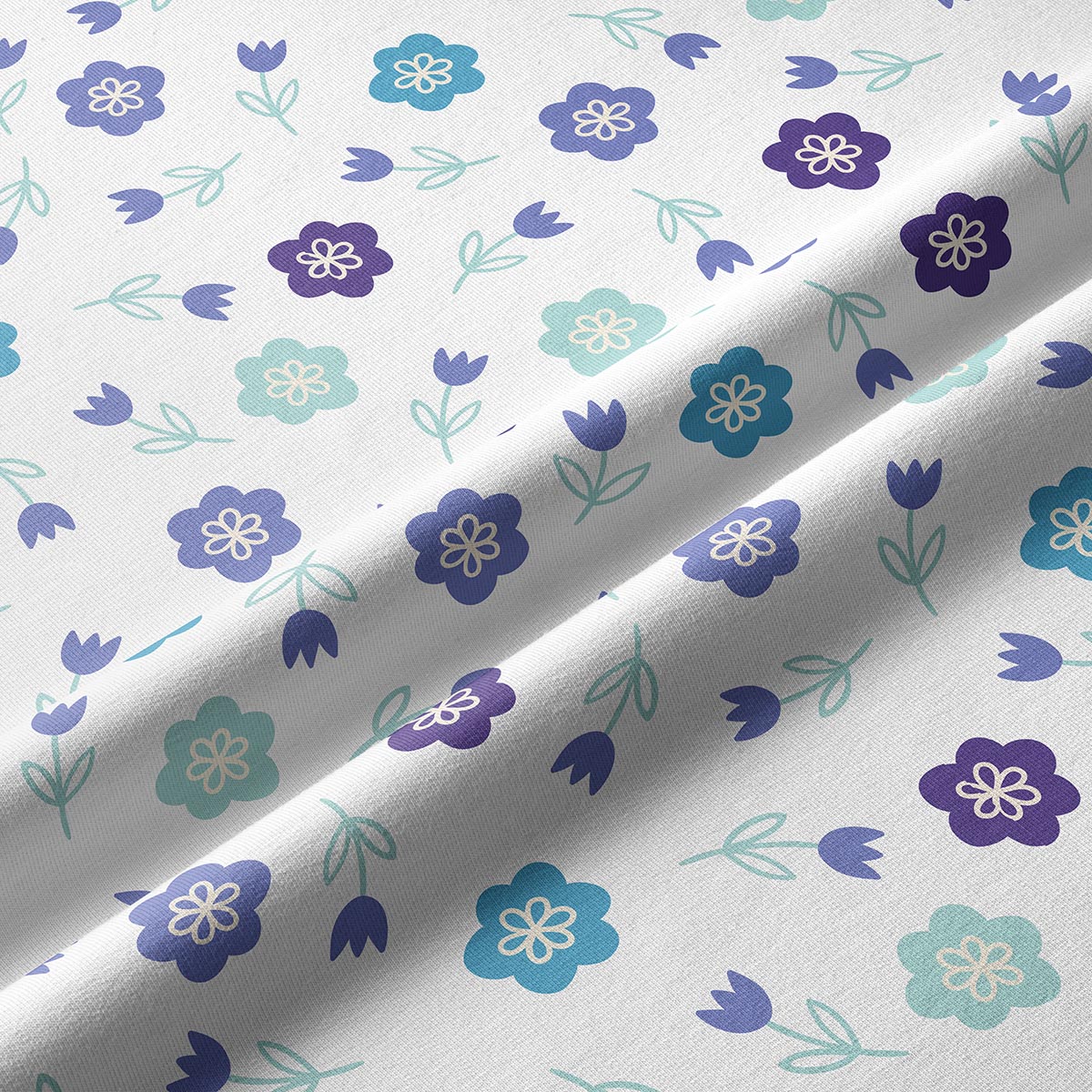 Zbliżenie na fakturę tkaniny i szczegóły stylizowanego, pastelowego motywu łąkowych kwiatków