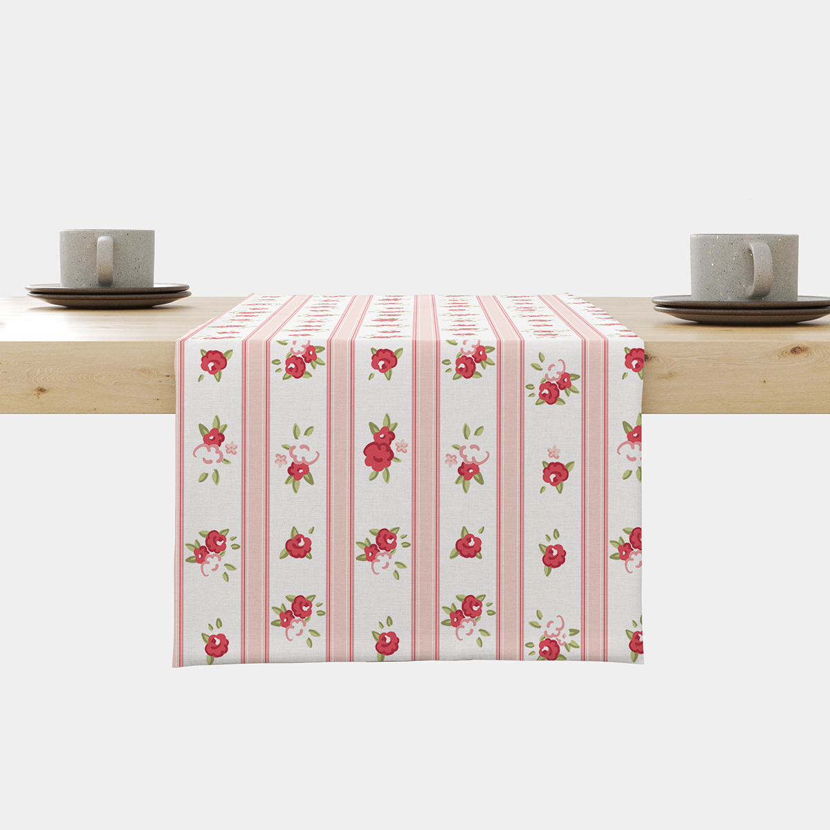 Bieżnik na stole z pionowymi różowymi pasami i drobnymi czerwonymi różyczkami widok z przodu