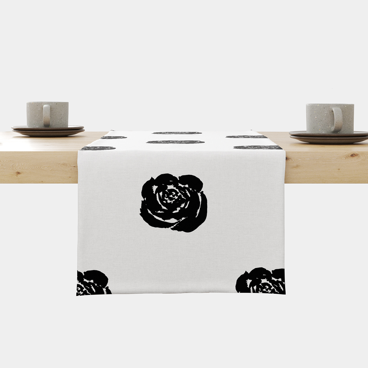 Bieżnik z dużymi, czarnymi graficznymi różami na jasnym tle