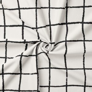 detal tkaniny z widoczną fakturą i nierównymi czarnymi liniami kratki