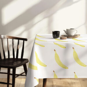 Perspektywa z góry pokazująca powtarzalny motyw żółtych bananów na białym tle