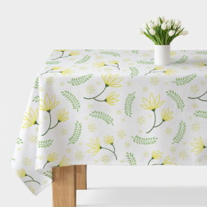 obrus na stole z żółtymi kwiatami i zielonymi listkami na białym tle, główne ujęcie