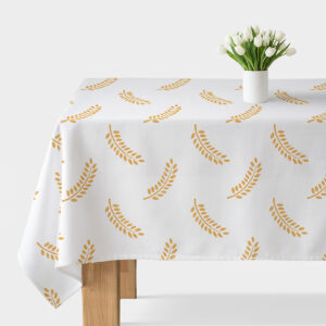 główne ujęcie obrus z białym tłem i powtarzalnym wzorem złotych gałązek z wazonem