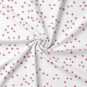 Zbliżenie na tkaninę ukazujące nieregularny, lekko malowany wzór kropek