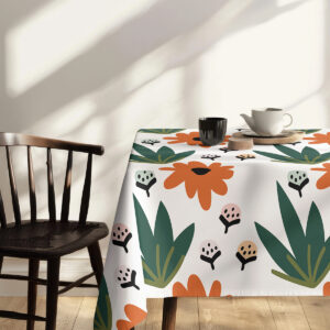 widok krawędzi obrusa przy krześle z powtarzającym się motywem kwiatów i pąków