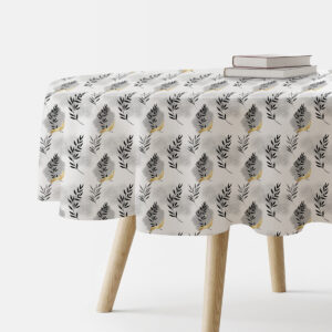 okragly obrus z delikatnymi czarnymi gałązkami i złotymi akcentami na białym tle, ujęcie produktu na stole