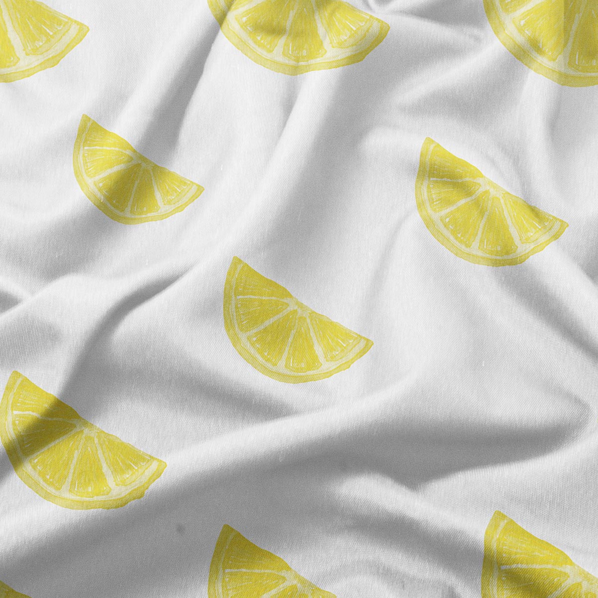 detal tkaniny z żółtymi plasterkami cytryny