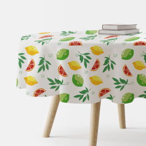 Okrągły obrus z motywem cytrusów i zielonych listków na białym tle, ujęcie główne na stole