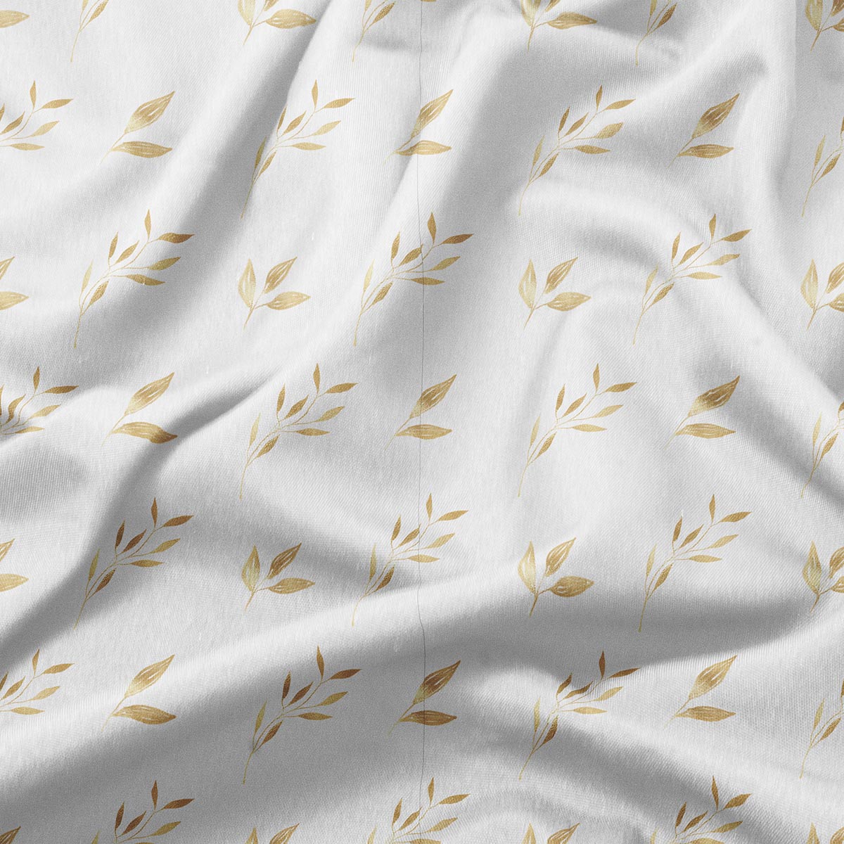 zbliżenie na tkaninę i detale złotych gałązek ukazujące fakturę materiału