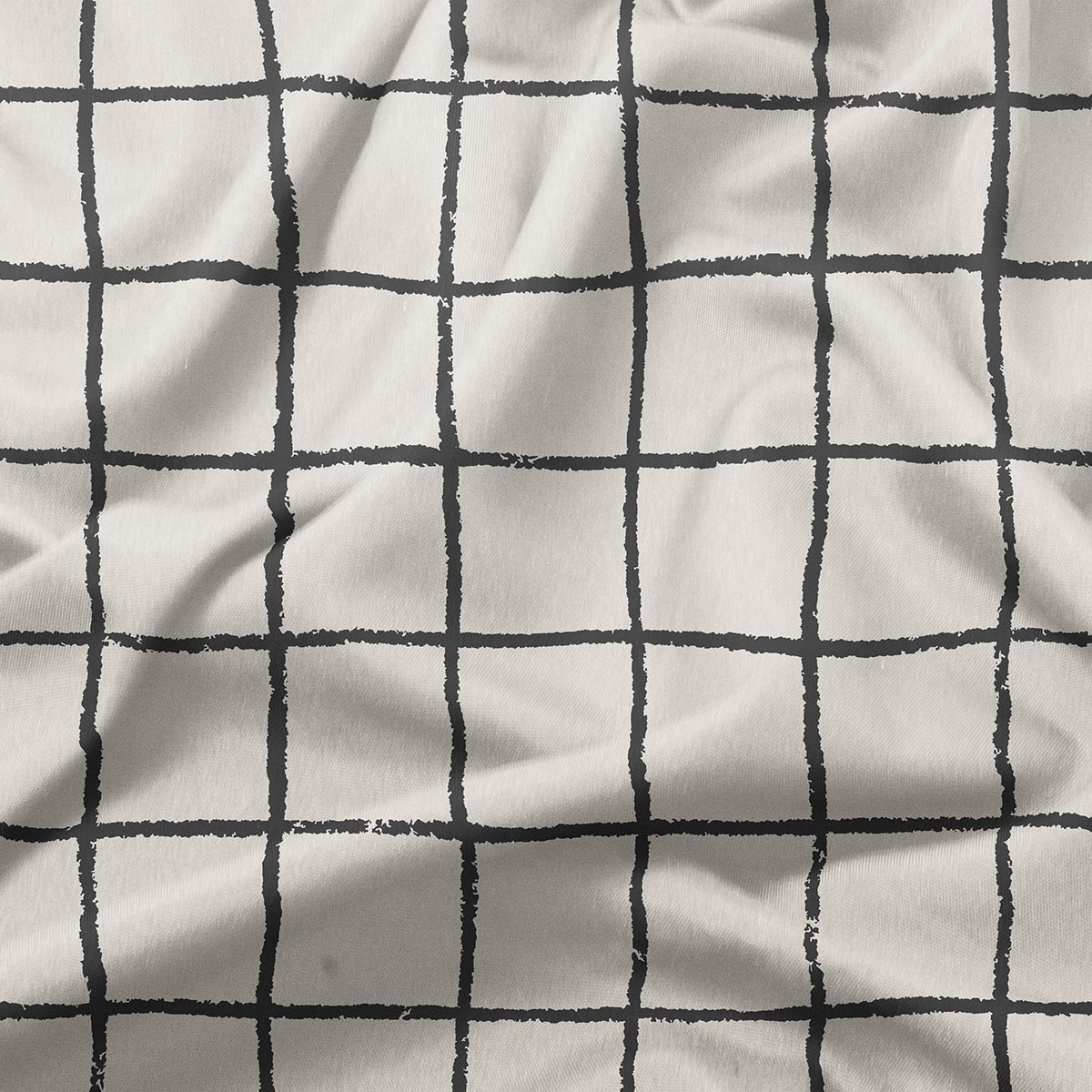 Zbliżenie na fakturę tkaniny i nieregularne pociągnięcia pędzla tworzące kratę