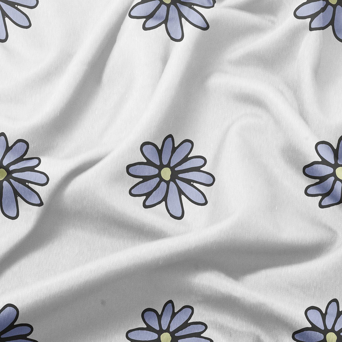 zbliżenie na materiał i nadruk stokrotek ukazujące fakturę tkaniny