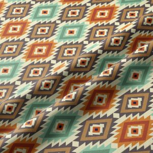 Zbliżenie na fakturę tkaniny i geometryczny wzór rombów w odcieniach mięty, terakoty i brązu