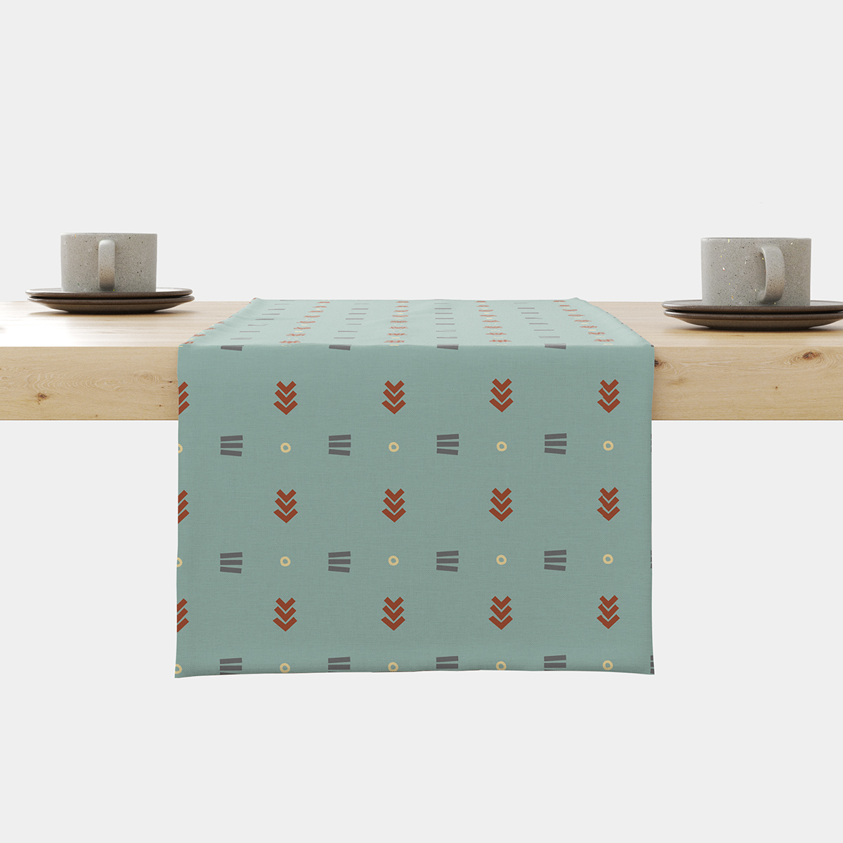 Bieżnik na stole w miętowym kolorze z powtarzalnym geometrycznym wzorem
