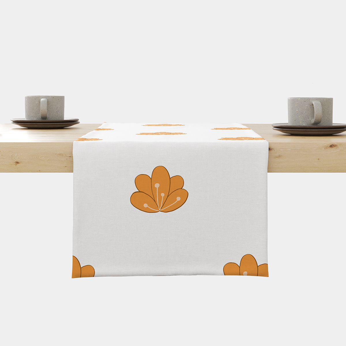Bieżnik na stole z powtarzalnym wzorem stylizowanych pomarańczowych kwiatów, ujęcie centralne