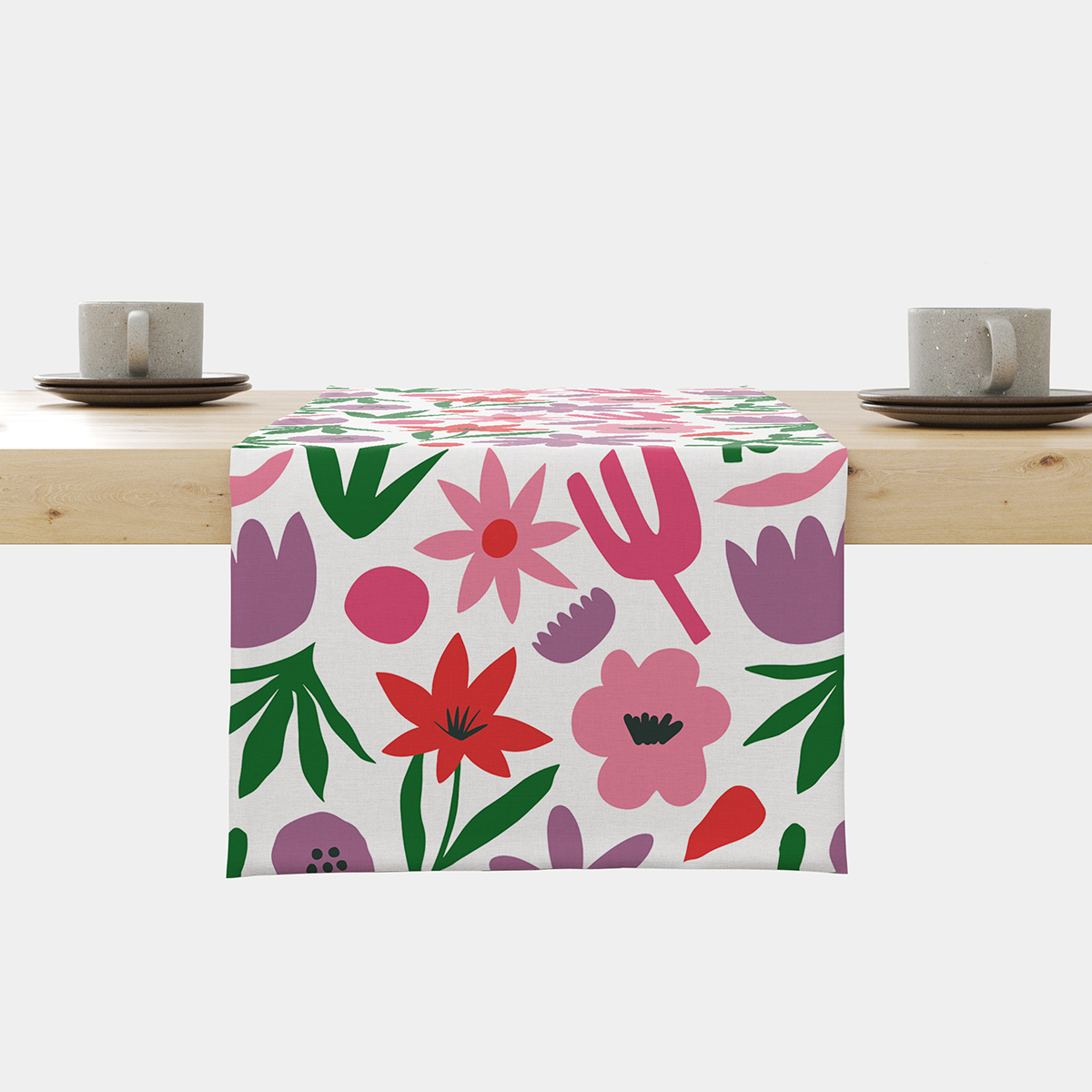 Bieżnik z kolorowym, dużym wzorem kwiatowym na białym tle ułożony na stole