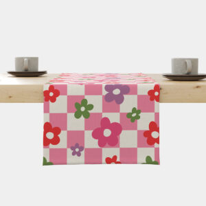 Bieżnik rozłożony na stole z różową kratką i kolorowymi kwiatami, widok główny