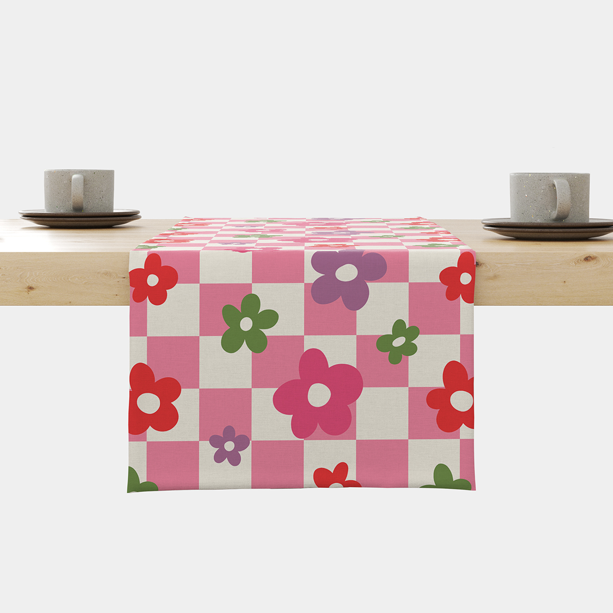 Bieżnik rozłożony na stole z różową kratką i kolorowymi kwiatami, widok główny