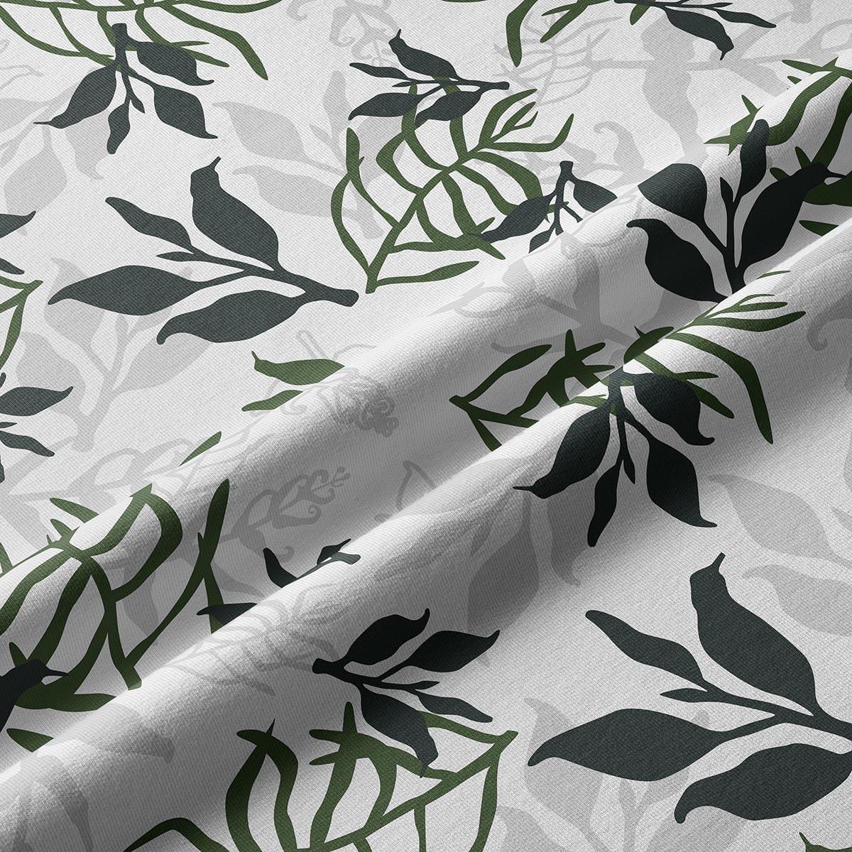 Zbliżenie na fakturę tkaniny i detale ciemnozielonych oraz oliwkowych liści