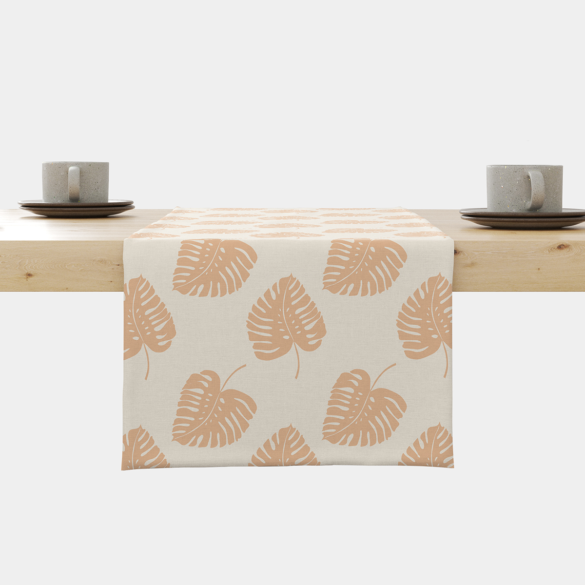 Bieżnik na stole z powtarzającym się wzorem liści w ciepłym odcieniu