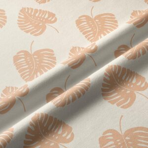 Zbliżenie tkaniny i nadruku liści, widoczna struktura materiału