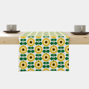 Bieżnik z geometrycznym wzorem słoneczników ułożony na jasnym stole z filiżankami