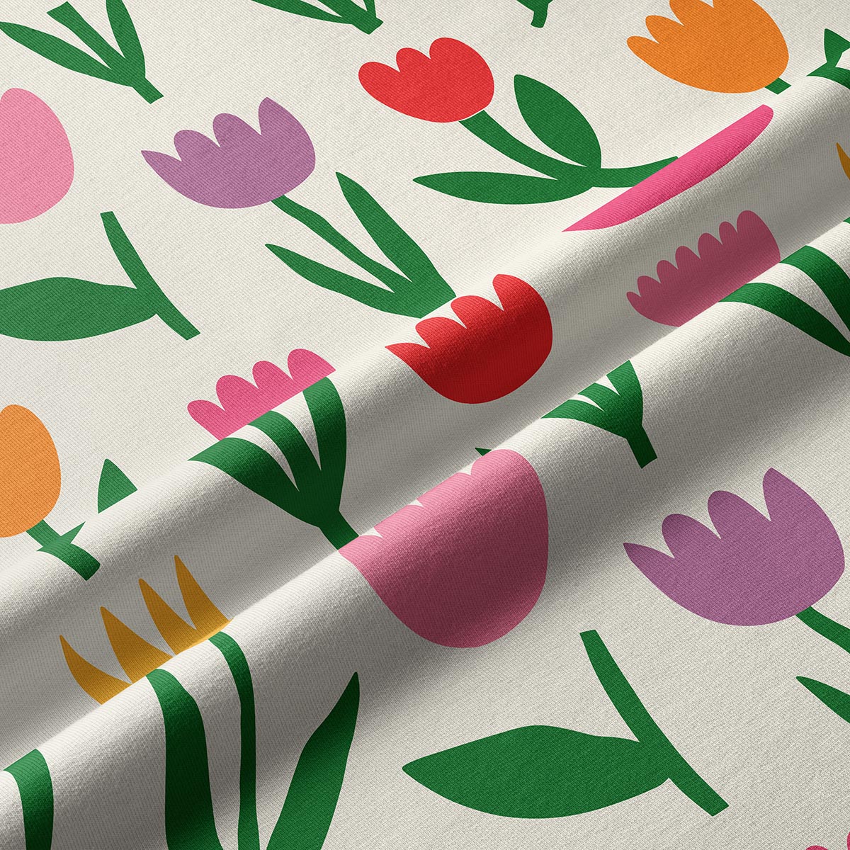 Zbliżenie na tkaninę pokazujące fakturę i detal nadruku tulipanów