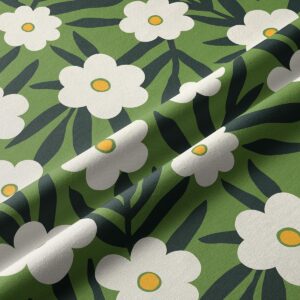 Zbliżenie na strukturę tkaniny i wzór białych kwiatów z zielonymi liśćmi