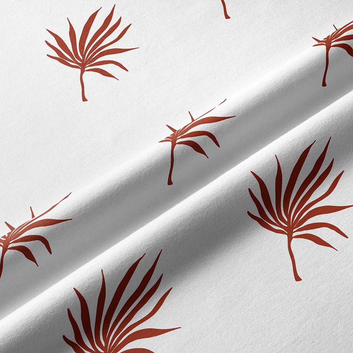 zbliżenie faktury tkaniny i rdzawy nadruk palmowych liści