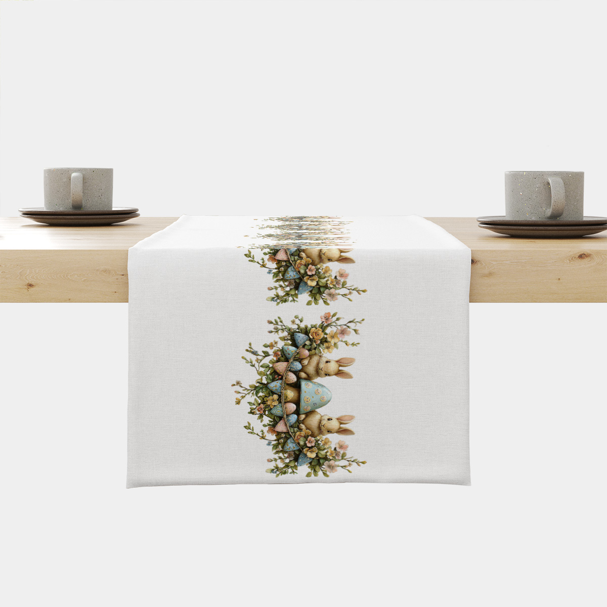 Bieżnik z motywem zajączków i pastelowych jajek ułożony na drewnianym stole