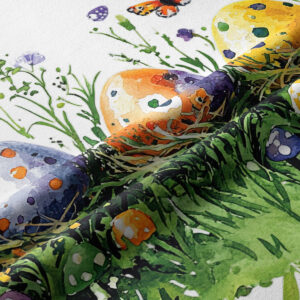 zbliżenie tkaniny pokazujące akwarelowe pisanki, trawę i detal faktury materiału