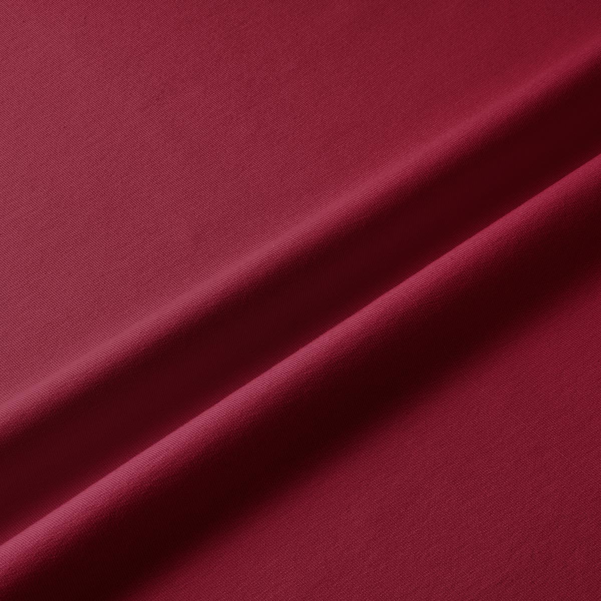 Zbliżenie na fakturę i gładkie wykończenie bordowego materiału bieżnika