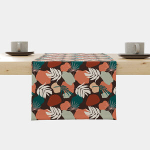 Bieżnik z motywem liści i organicznych plam rozłożony na stole, widok główny