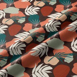 Zbliżenie na fakturę tkaniny i detale wzoru z nieregularnymi plamami i liśćmi