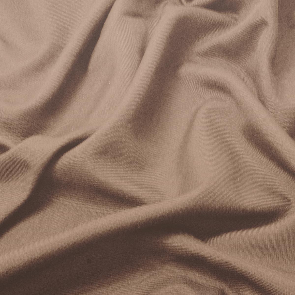 zbliżenie na miękką fakturę brązowej tkaniny obrusowej