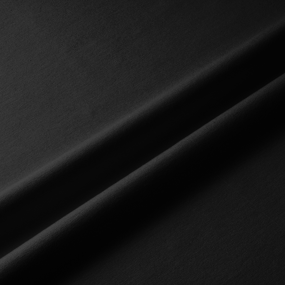 zbliżenie na fakturę gładkiego czarnego materiału bieżnika