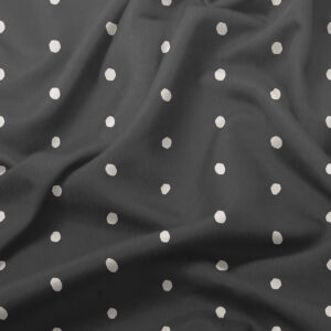 Zbliżenie na fakturę tkaniny i nieregularne białe kropeczki