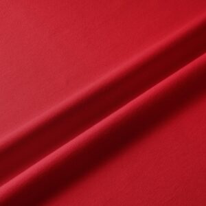 zbliżenie na fakturę czerwonego materiału bieżnika z widocznym splotem