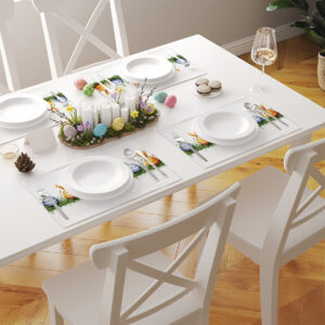 aranżacja stołu z kilkoma podkładkami z motywem pisanek tworzącymi świąteczną oprawę