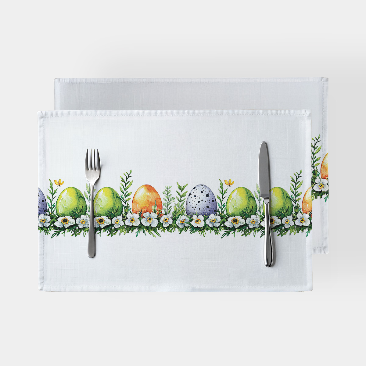 Podkładki z rzędem kolorowych pisanek i drobnych kwiatów na białym tle, główny widok produktu