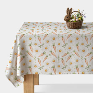 Świąteczny obrus z wzorem marchewek i stokrotek, widok stołu z koszykiem wielkanocnym